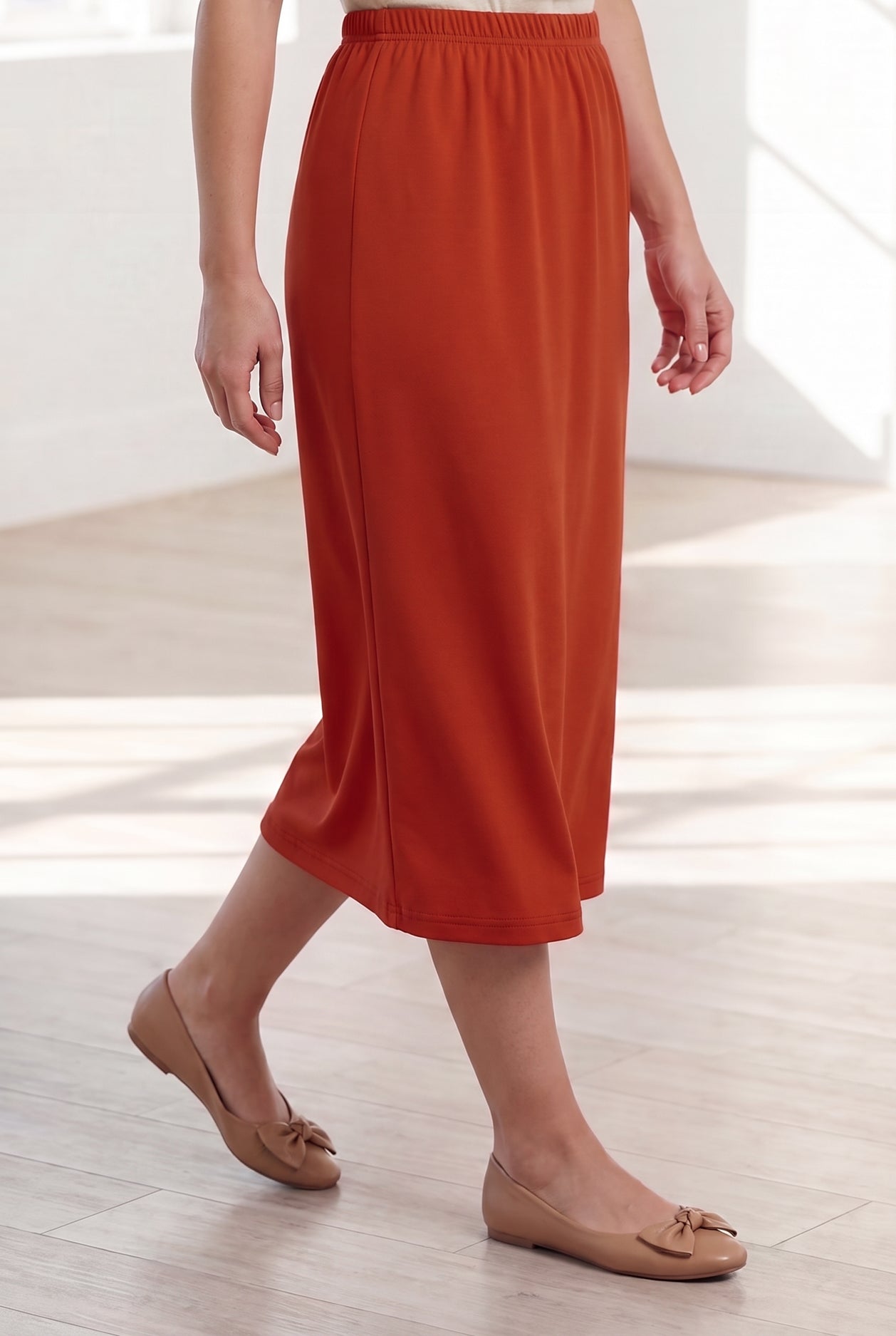 Model wearing Nuggles® 31" Classic Skirt in Burnt Orange