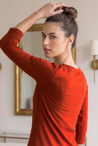 Model wearing Nuggles®  Essential 3/4 Sleeve Tee in Burnt Orange
