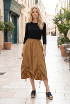 Model wearing Nuggles® Oriana Skirt in Camel