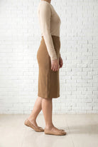 Model wearing Nuggles® 25" Relaxed Skirt in Camel