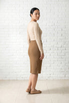 Model wearing Nuggles® 25" Relaxed Skirt in Camel