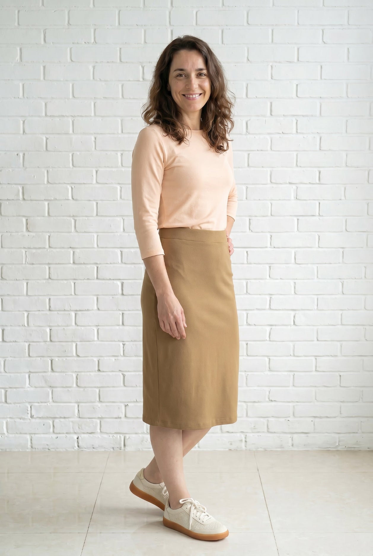 Model wearing Nuggles® 27" Relaxed Skirt in Camel