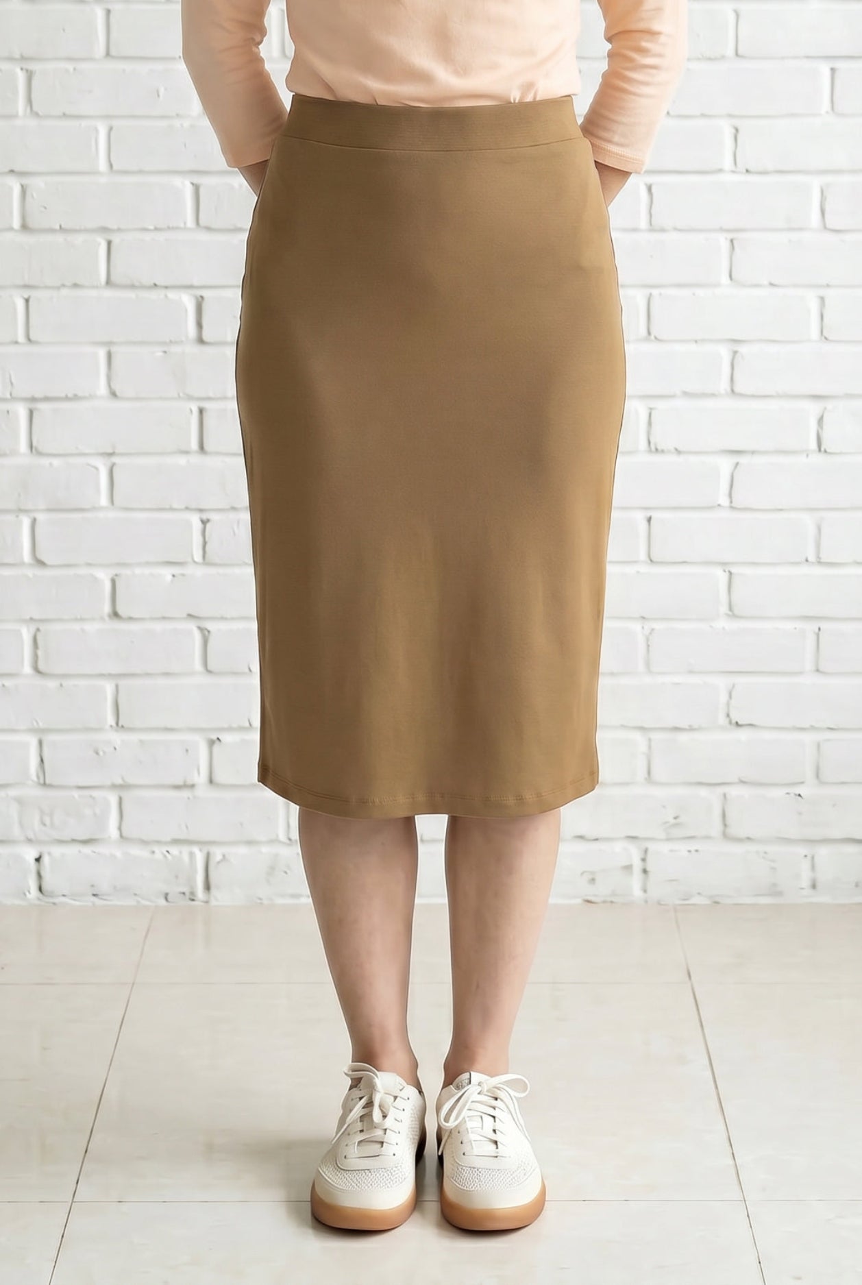 Model wearing Nuggles® 27" Relaxed Skirt in Camel