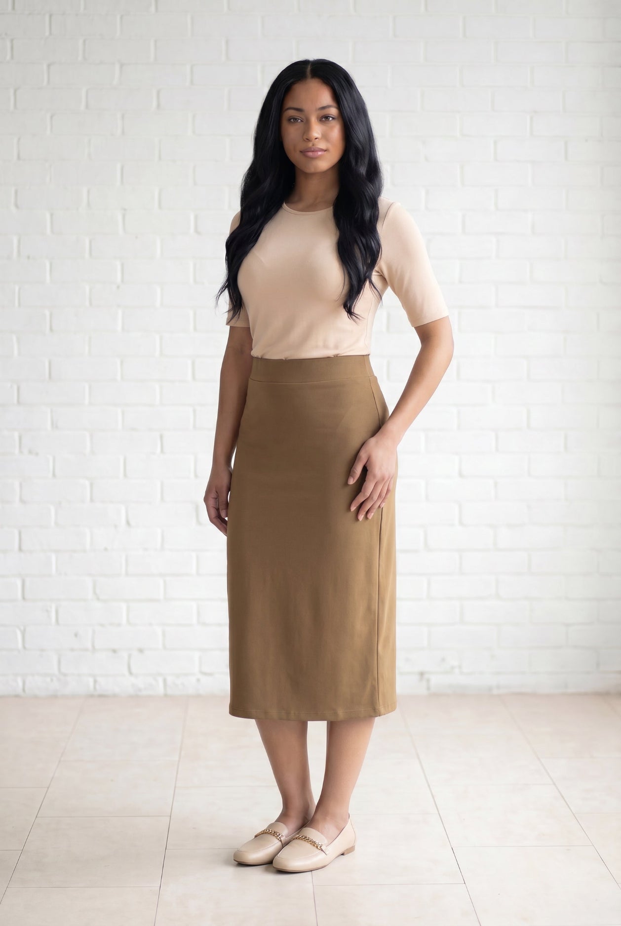 Model wearing Nuggles® 31" Relaxed Skirt in Camel