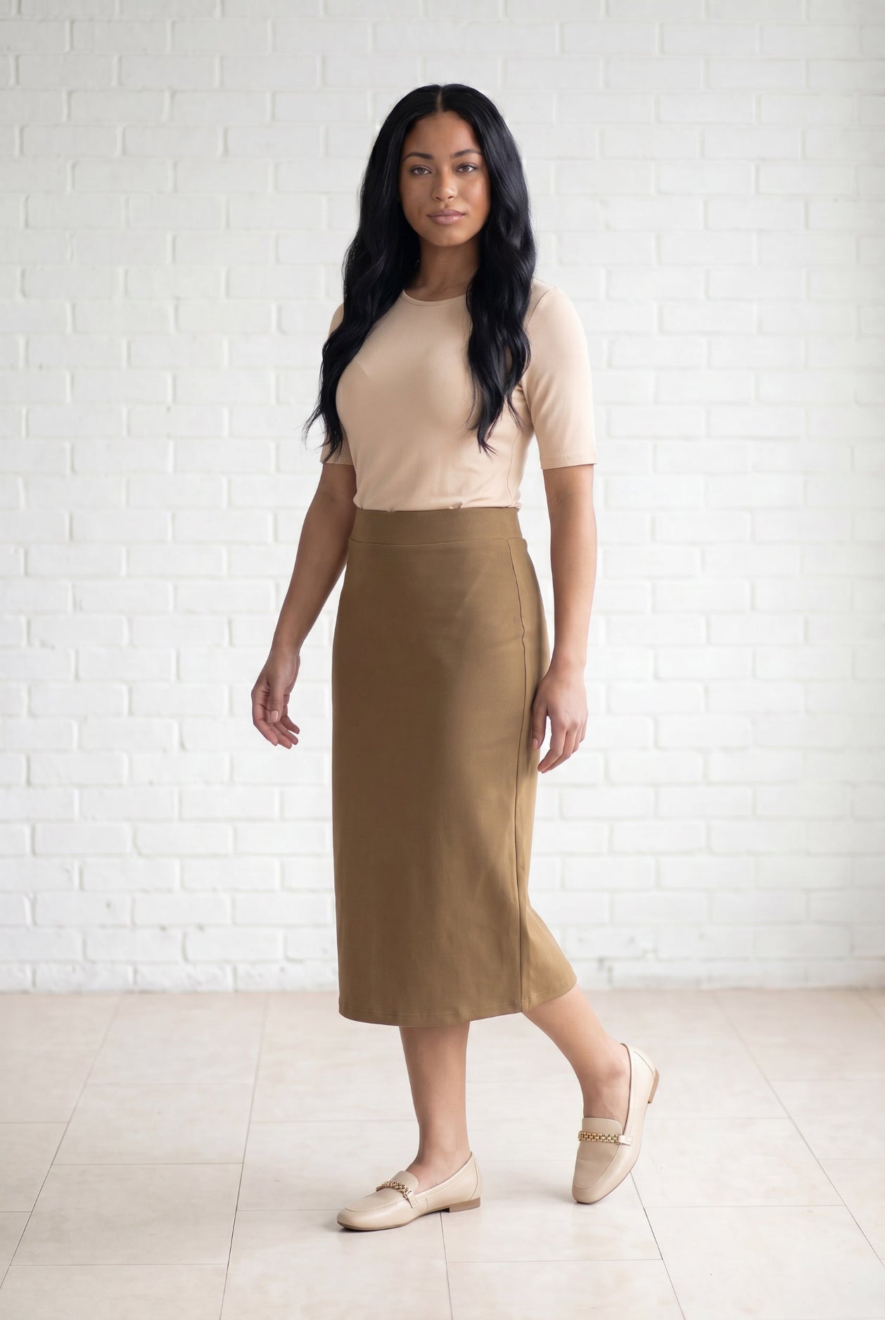 Model wearing Nuggles® 31" Relaxed Skirt in Camel