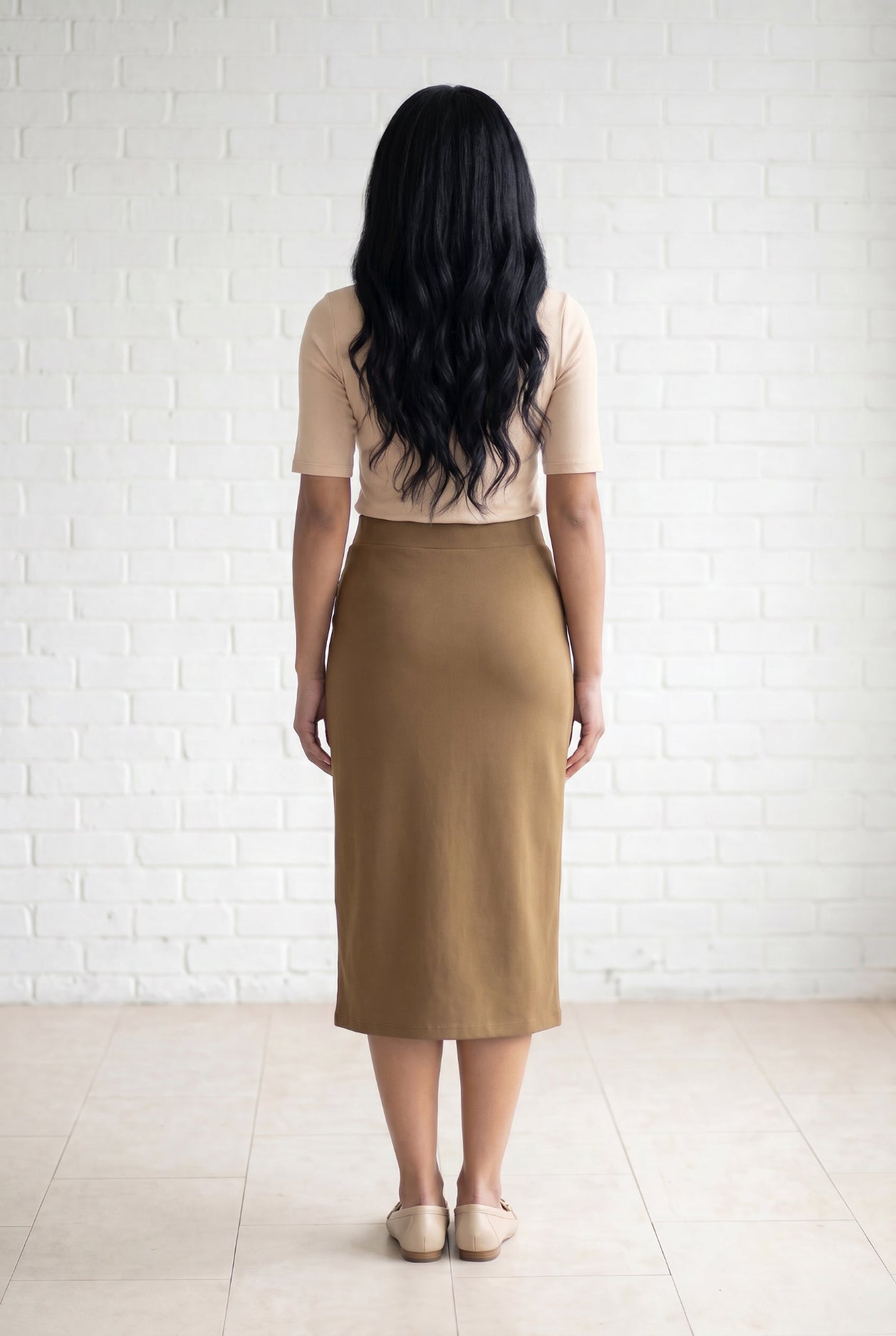 Model wearing Nuggles® 31" Relaxed Skirt in Camel