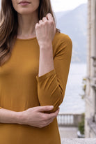 Model wearing Nuggles® Maxi Layering  Dress in Camel