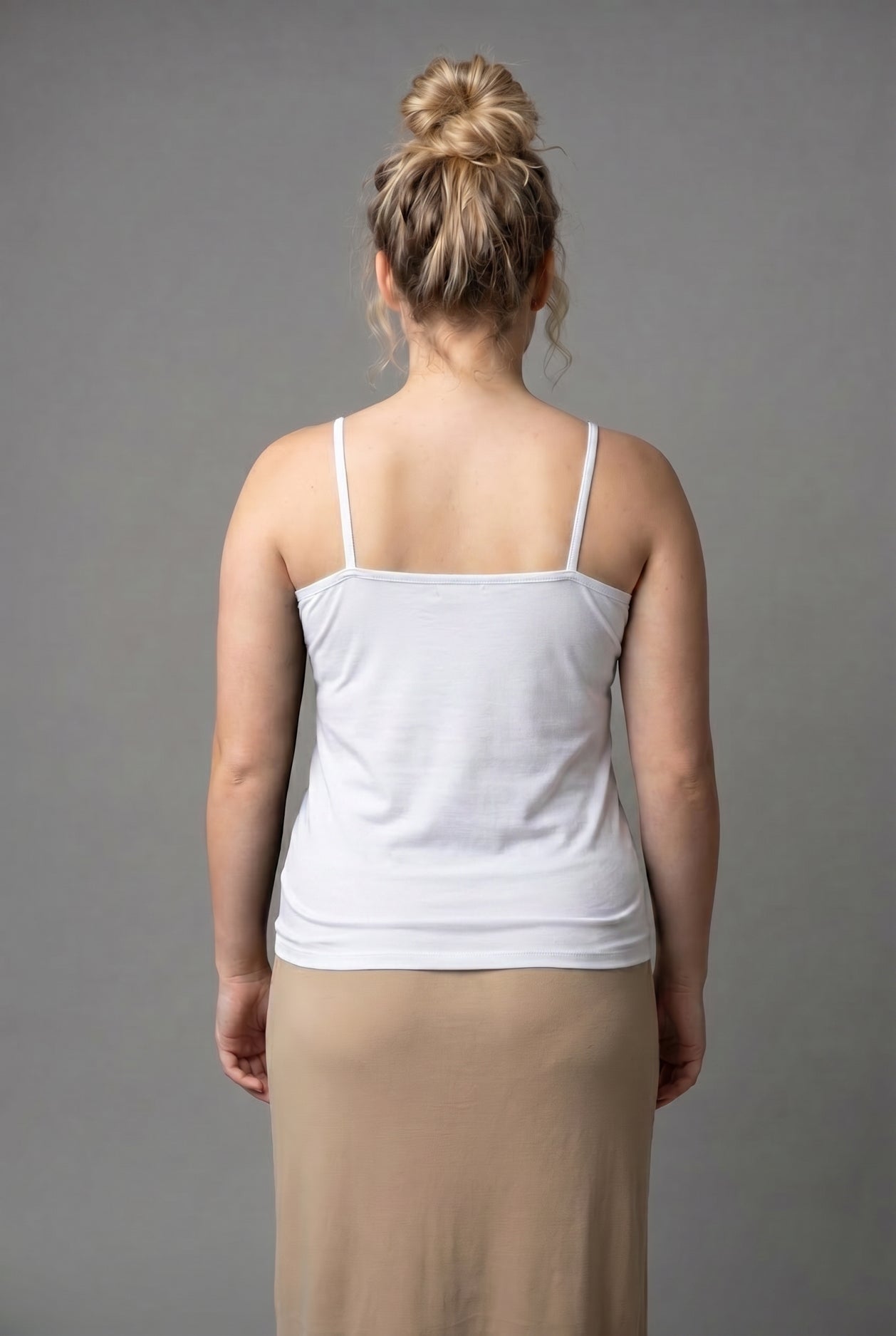 Model wearing Nuggles® Camisole in White