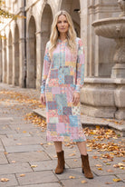 Nuggles® Hoodie Dress in Candy Lane, full length with the hood down, pastel patchwork print