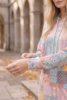 Nuggles® Hoodie Dress in Candy Lane, close-up of the sleeve cuff and patchwork print at the wrist