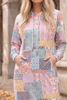 Nuggles® Hoodie Dress in Candy Lane, both hands in the front kangaroo pocket