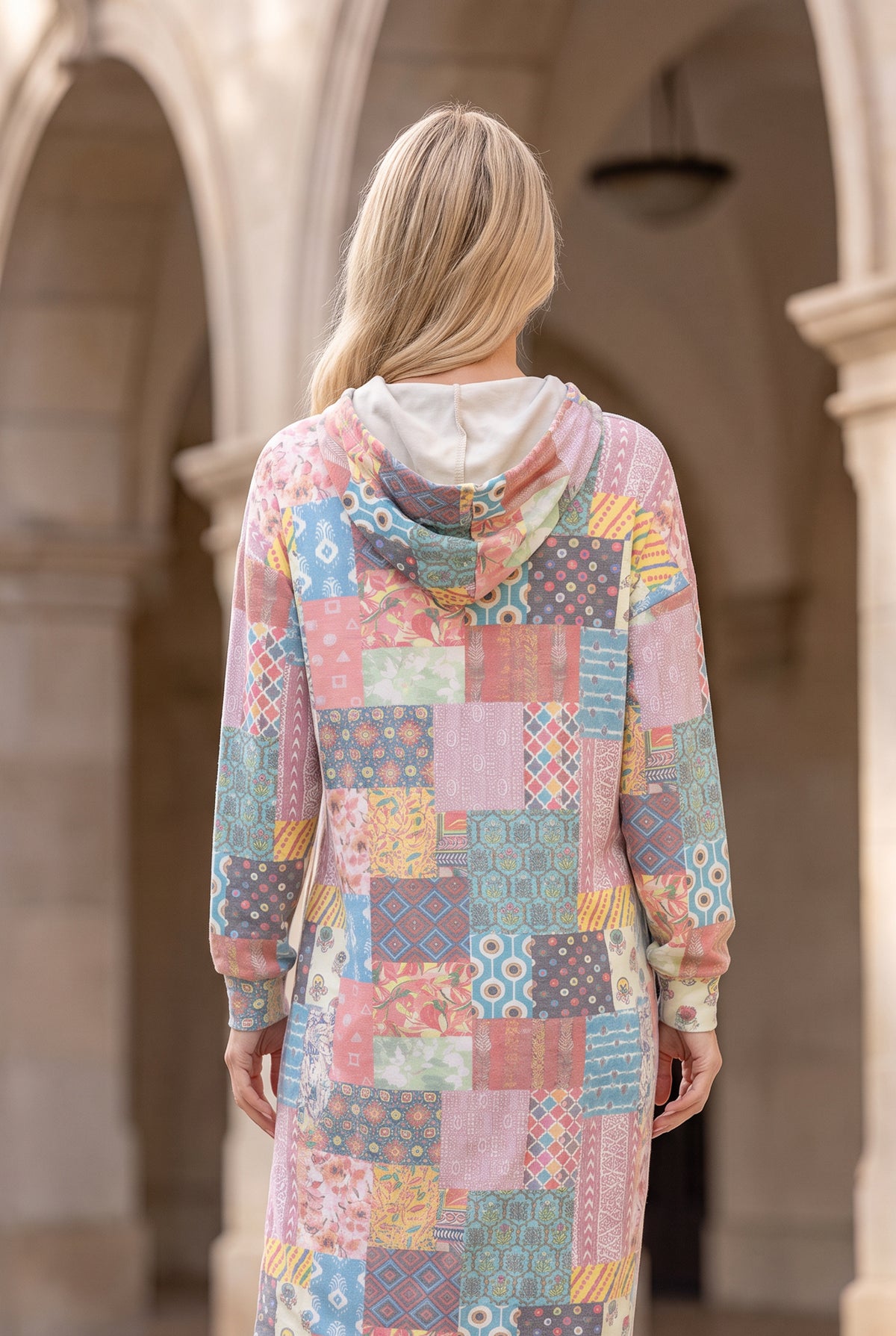 Nuggles® Hoodie Dress in Candy Lane, back view with the hood down over its cream lining