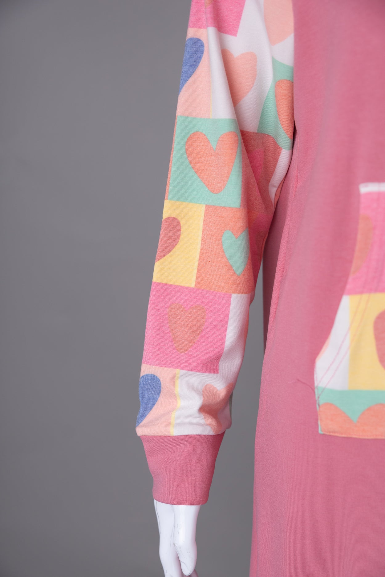 Model wearing Nuggles®  Hoodie Dress in Candy Hearts