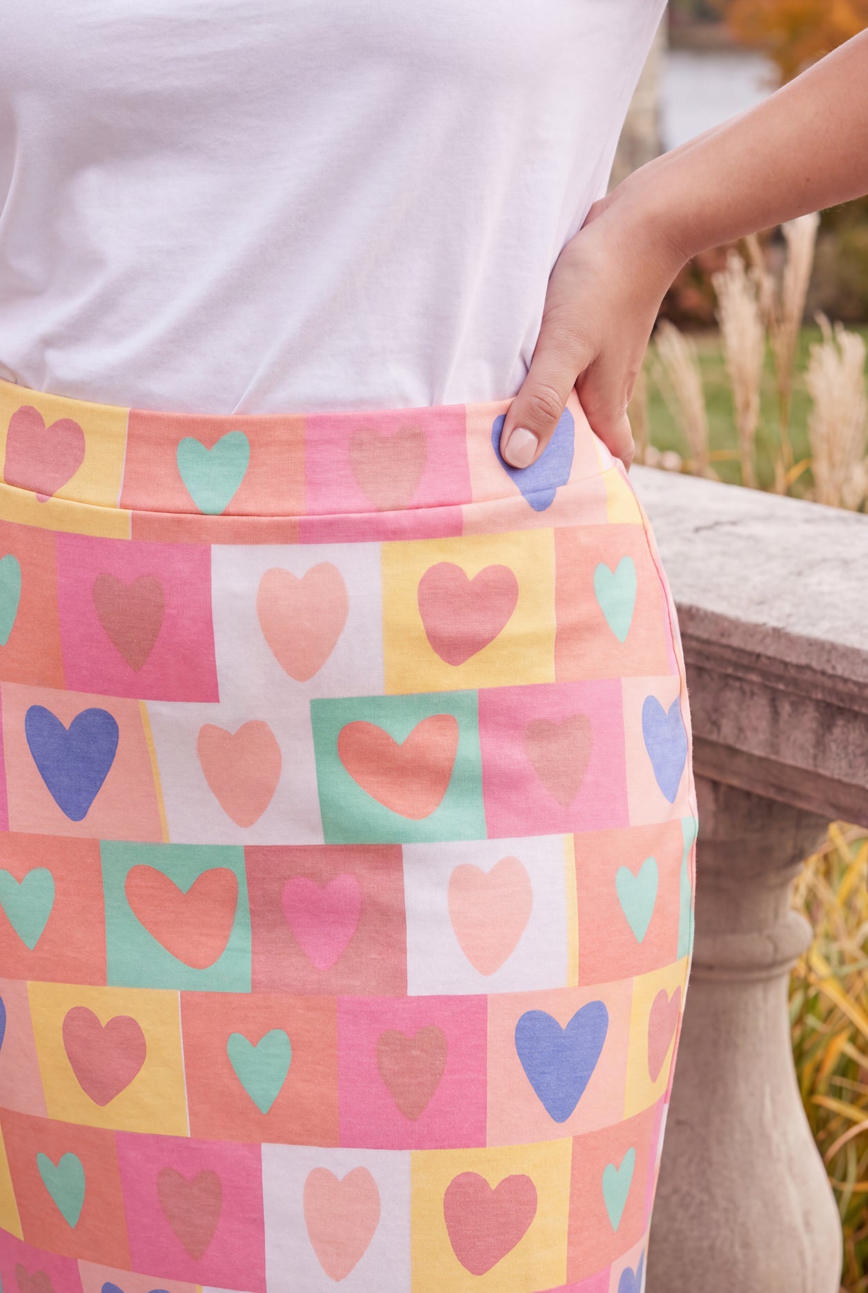 Model wearing Nuggles®  Iris Sweater Skirt in Candy Hearts
