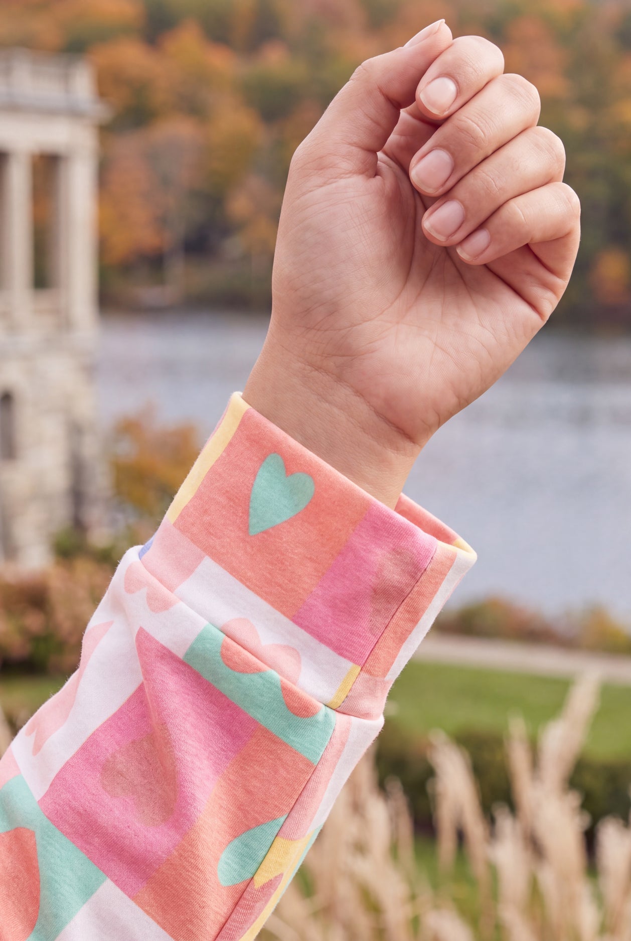 Model wearing Nuggles®  Iris Sweater Shirt in Candy Hearts
