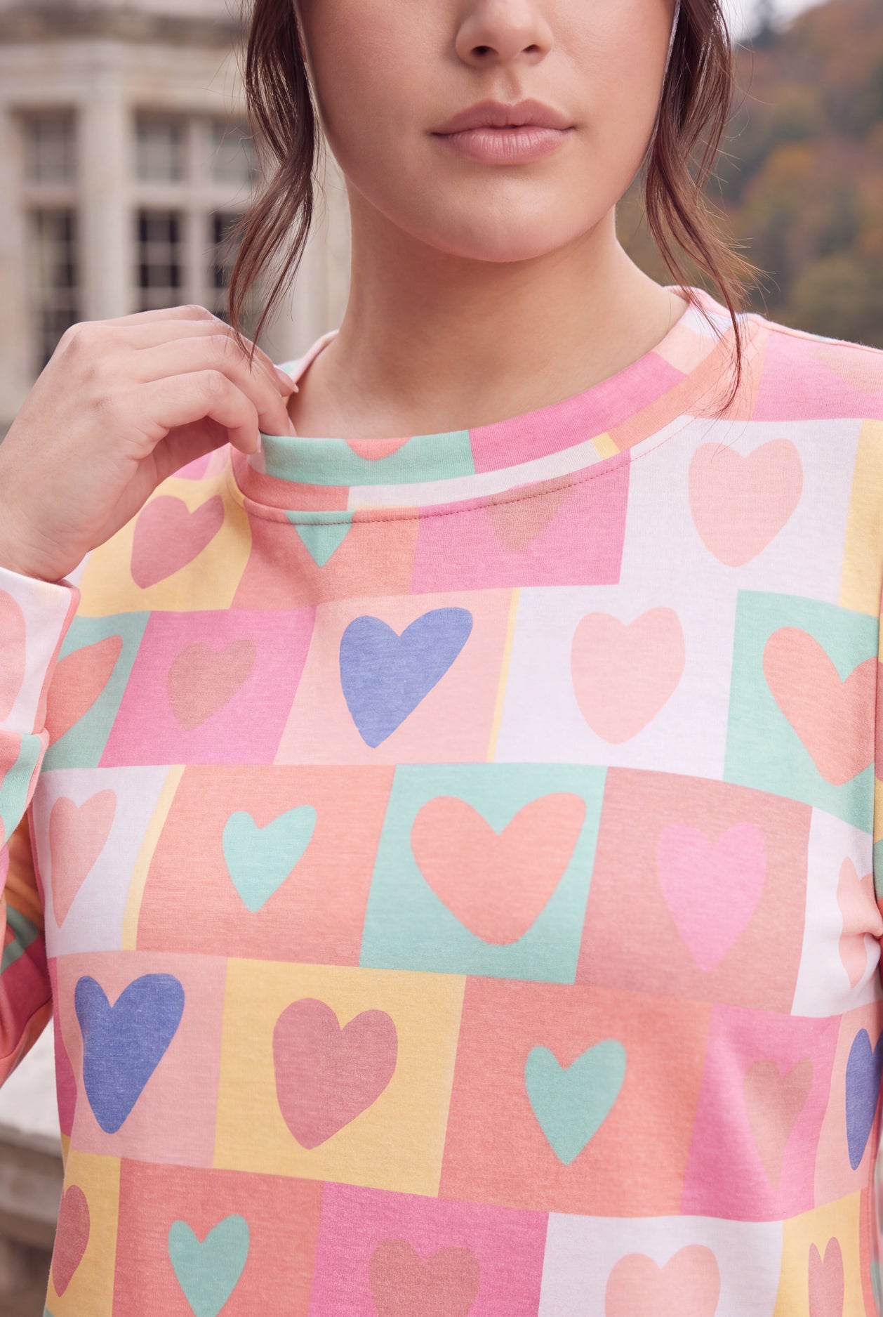 Model wearing Nuggles®  Iris Sweater Shirt in Candy Hearts