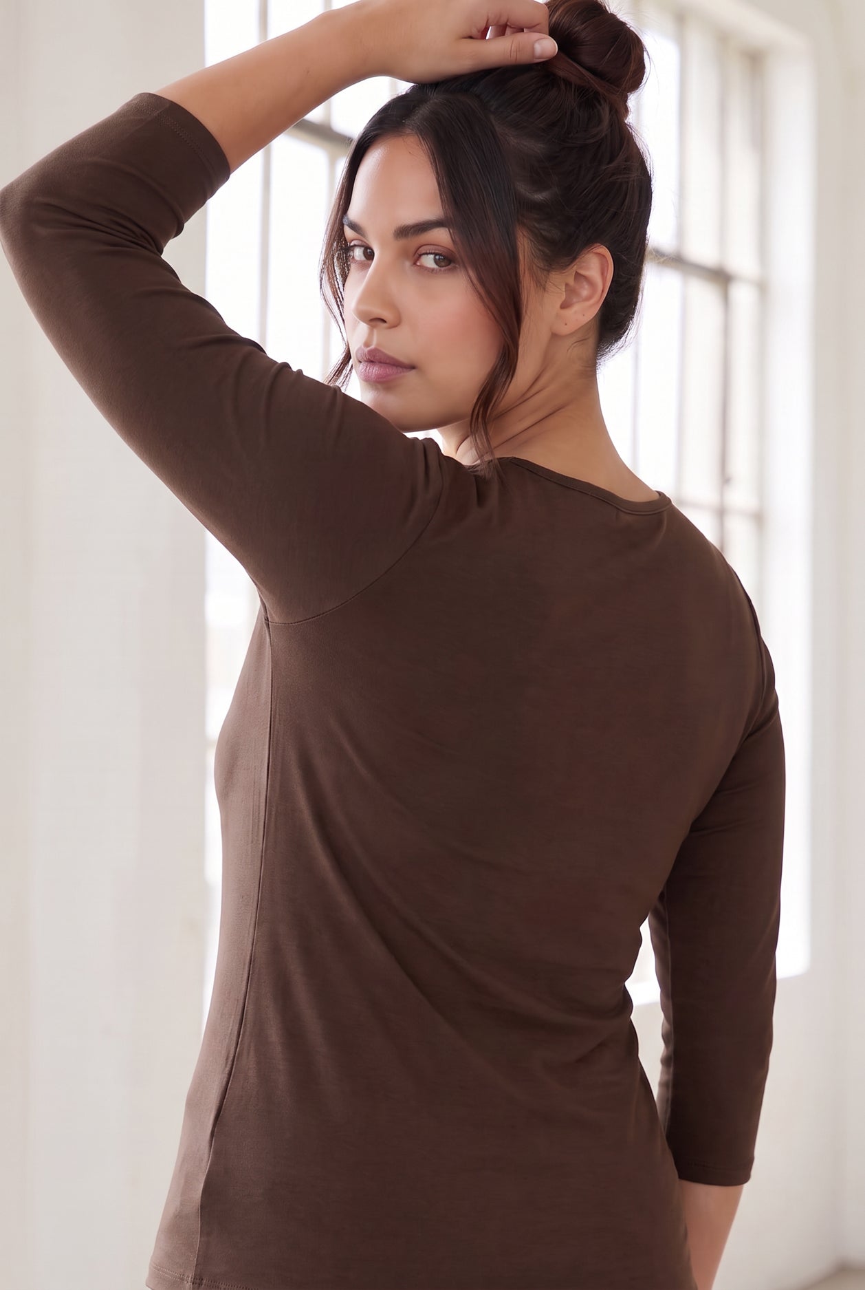 Model wearing Nuggles®  Essential  3/4 Tee in Chocolate Brown