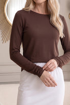 Model wearing Nuggles®  Long Sleeve Essential Tee in Chocolate Brown