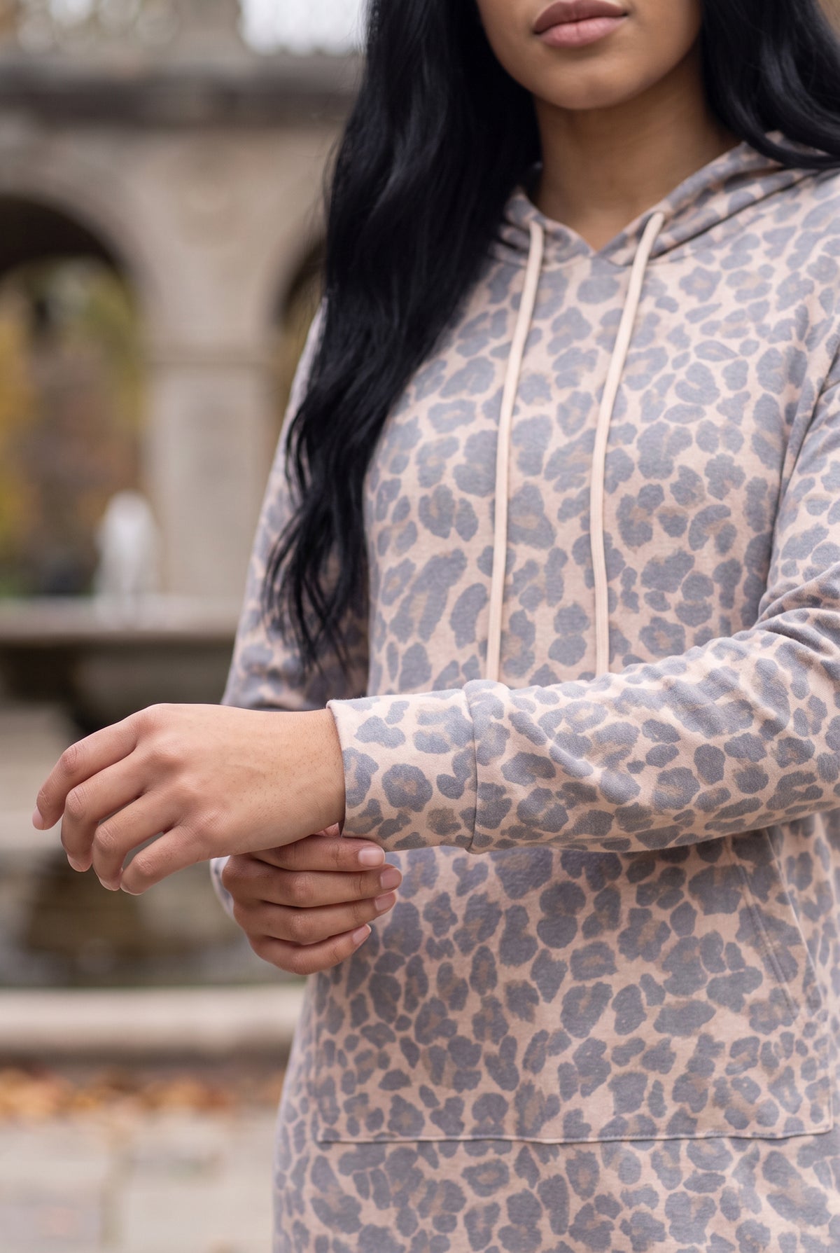 Nuggles® Hoodie Dress in Classic Leopard, close-up of the sleeve cuff and tan and black leopard print