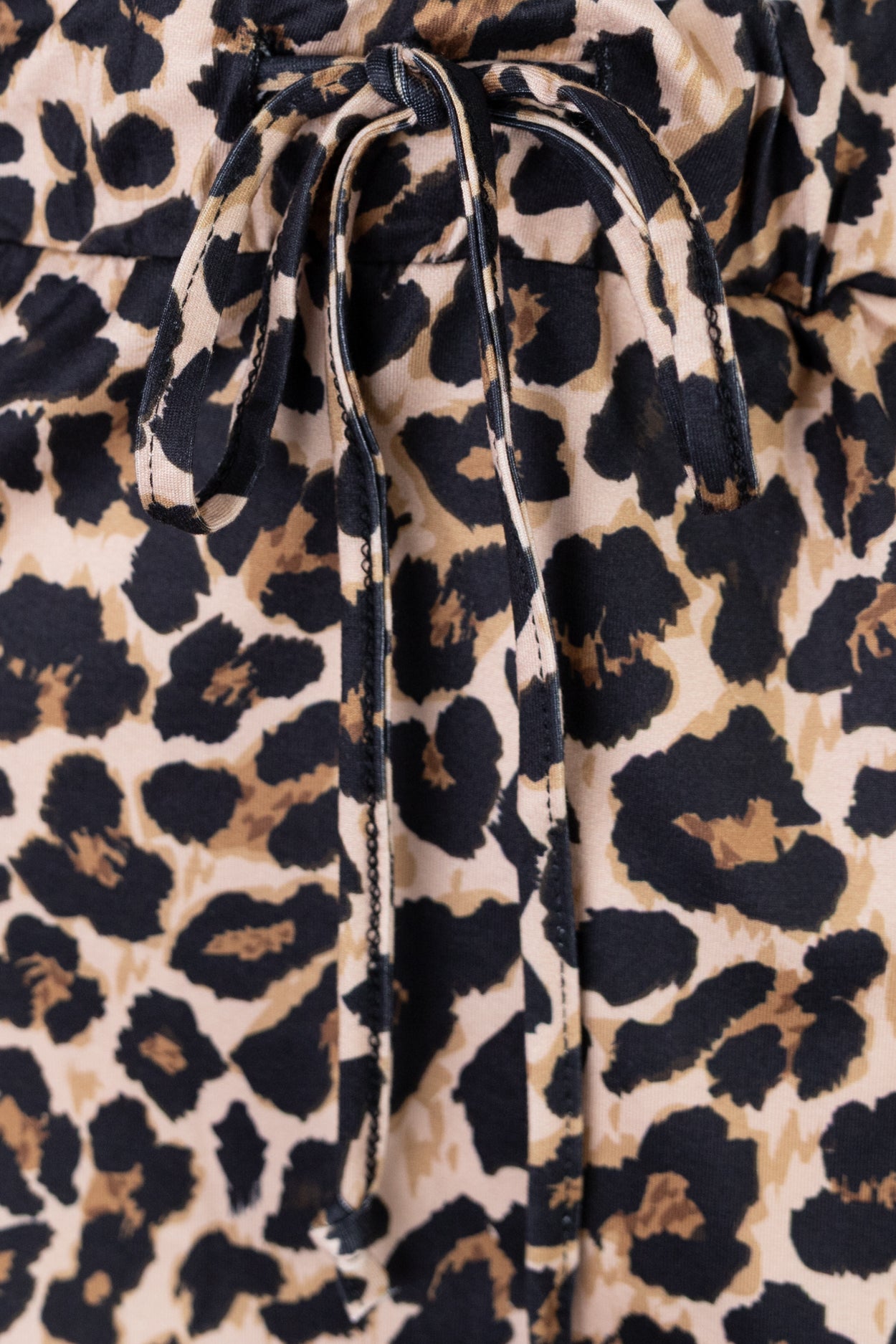Model wearing Nuggles®  31" Drawstring Skirt in Classic Leopard