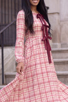 Model wearing Nuggles®  Addison Dress in Cranberry Paid