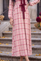 Model wearing Nuggles®  Addison Dress in Cranberry Paid