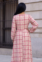 Model wearing Nuggles®  Addison Dress in Cranberry Paid