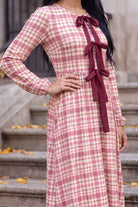 Model wearing Nuggles®  Addison Dress in Cranberry Paid