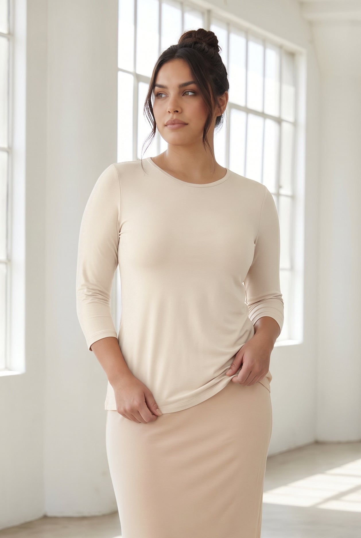 Model wearing Nuggles® 3/4 Essential Tee in Cream