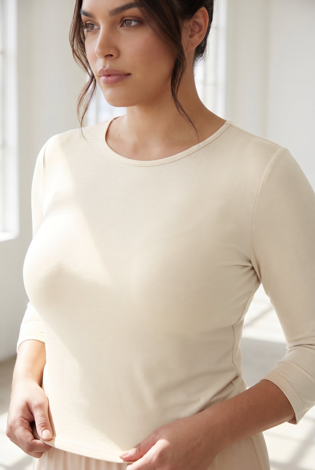 Model wearing Nuggles® 3/4 Essential Tee in Cream