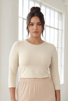 Model wearing Nuggles® 3/4 Essential Tee in Cream