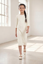 Model wearing Nuggles® Girls Midi Layering Dress in Cream