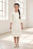 Model wearing Nuggles® Girls Midi Layering Dress in Cream