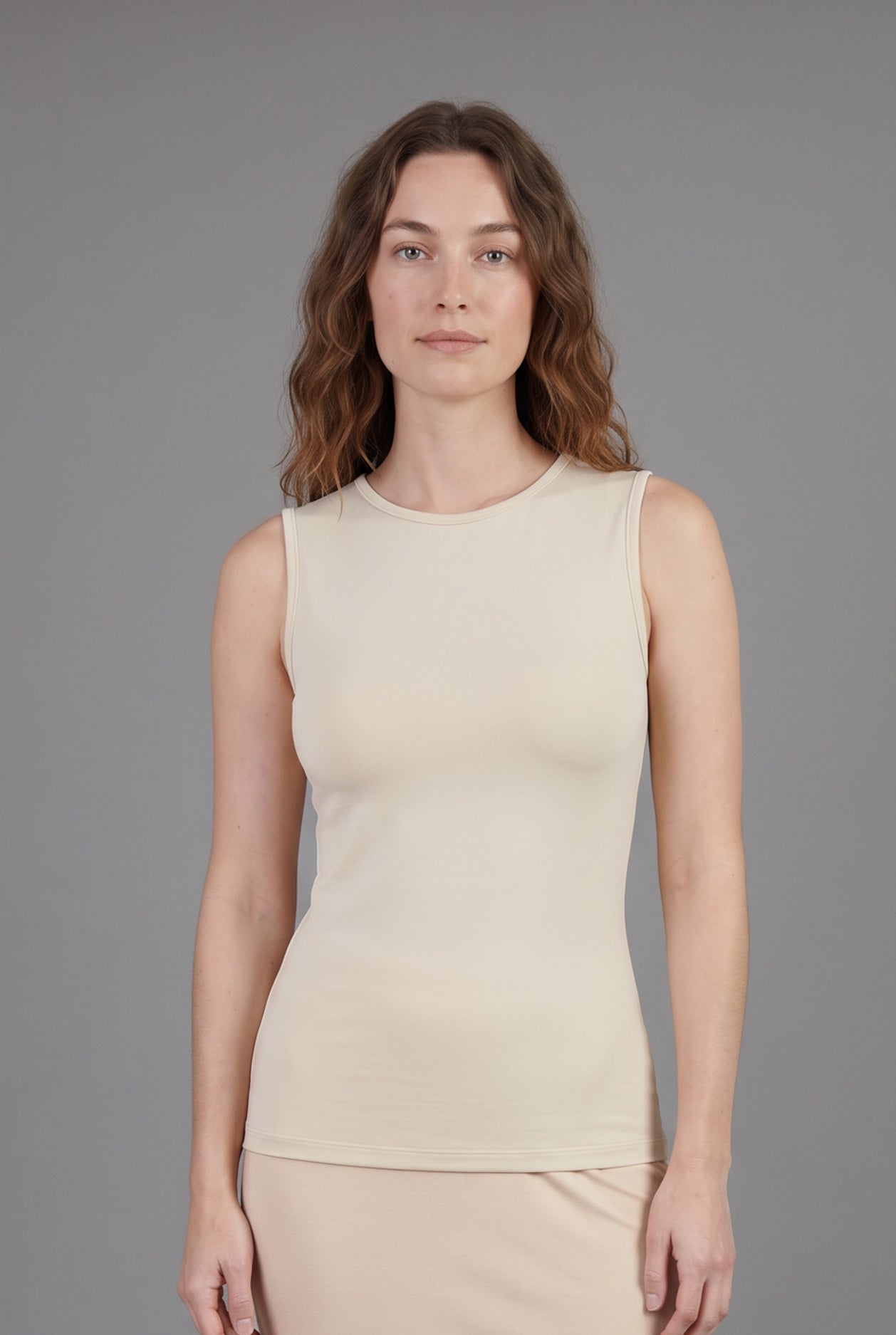 Model wearing Nuggles® Essential Tank in Cream