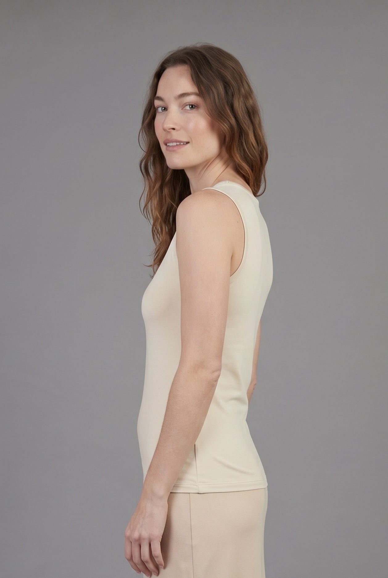 Model wearing Nuggles® Essential Tank in Cream
