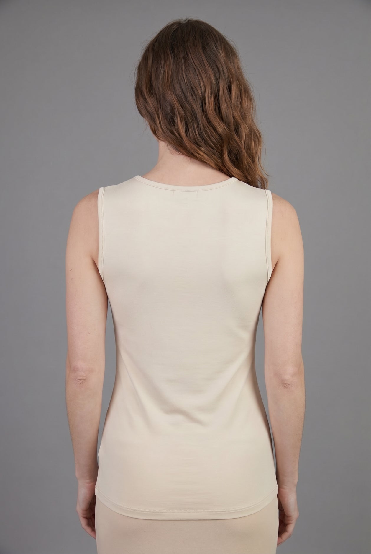 Model wearing Nuggles® Essential Tank in Cream
