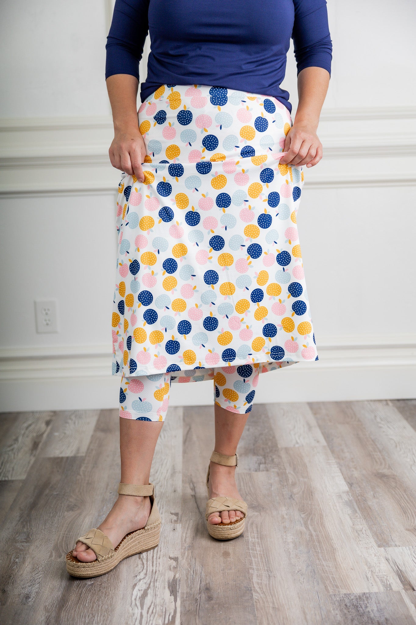 Modest activewear skirt with built-in leggings for women, breathable athletic fabric, paired with sneakers – perfect for workouts or casual wear.