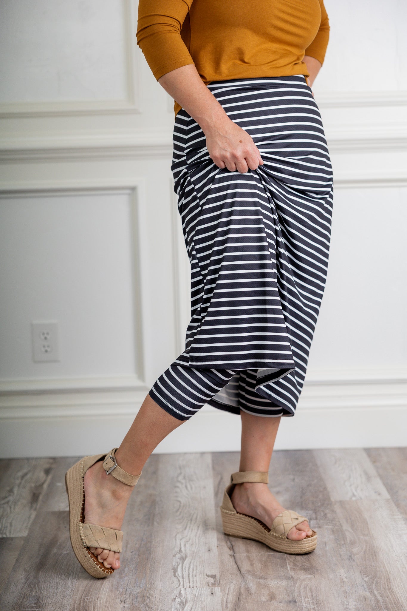 Modest activewear skirt with built-in leggings for women, breathable athletic fabric, paired with sneakers – perfect for workouts or casual wear.