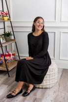 Nuggles® Farah Dress in solid color, modest long sleeve midi dress with empire waist, styled with flats for everyday wear.