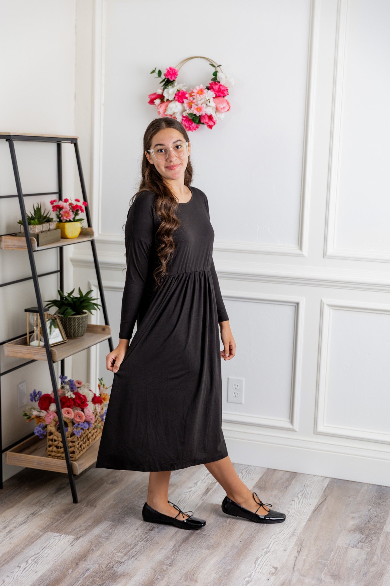 Nuggles® Farah Dress in solid color, modest long sleeve midi dress with empire waist, styled with flats for everyday wear.