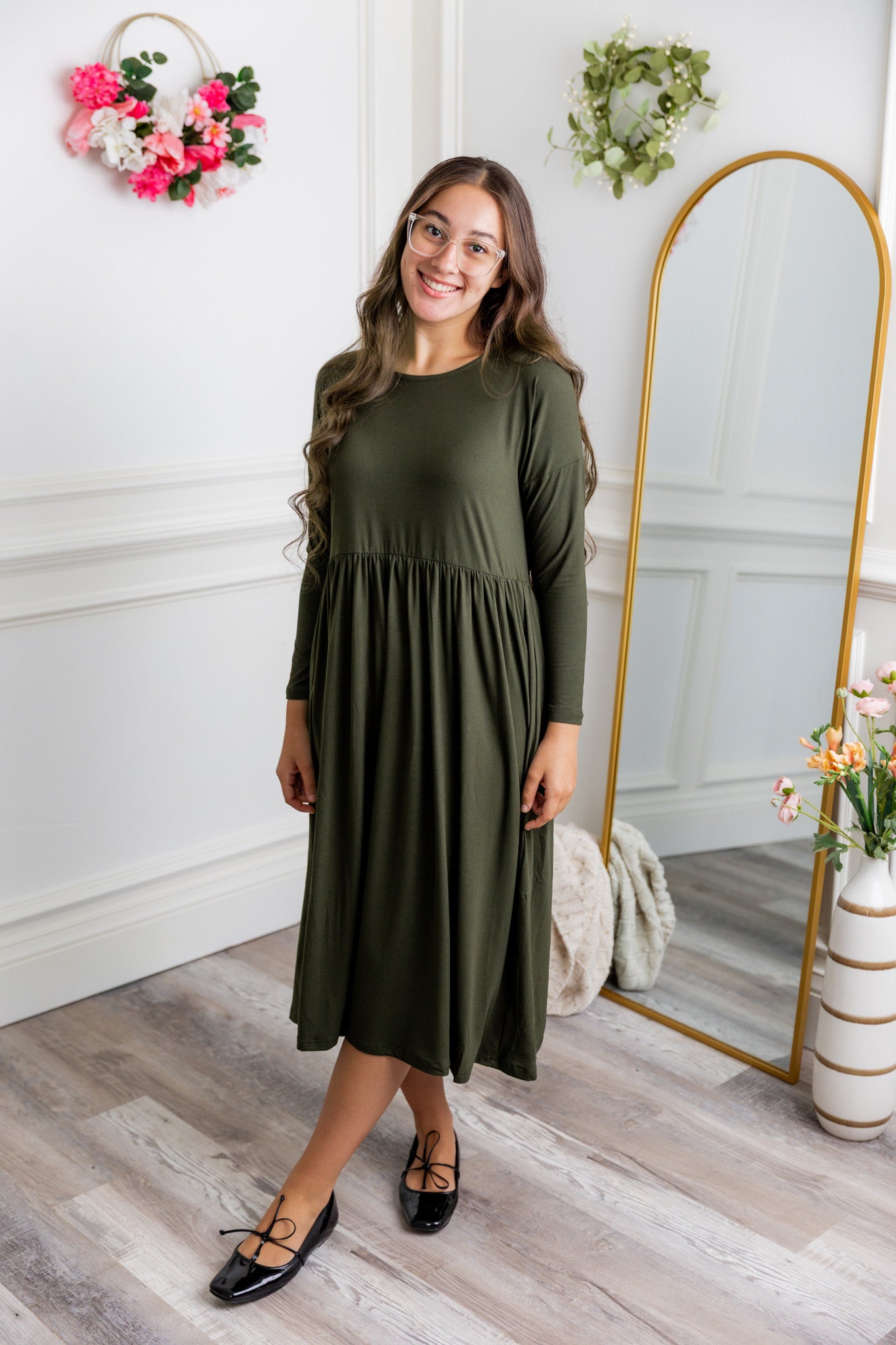 Nuggles® Farah Dress in solid color, modest long sleeve midi dress with empire waist, styled with flats for everyday wear.