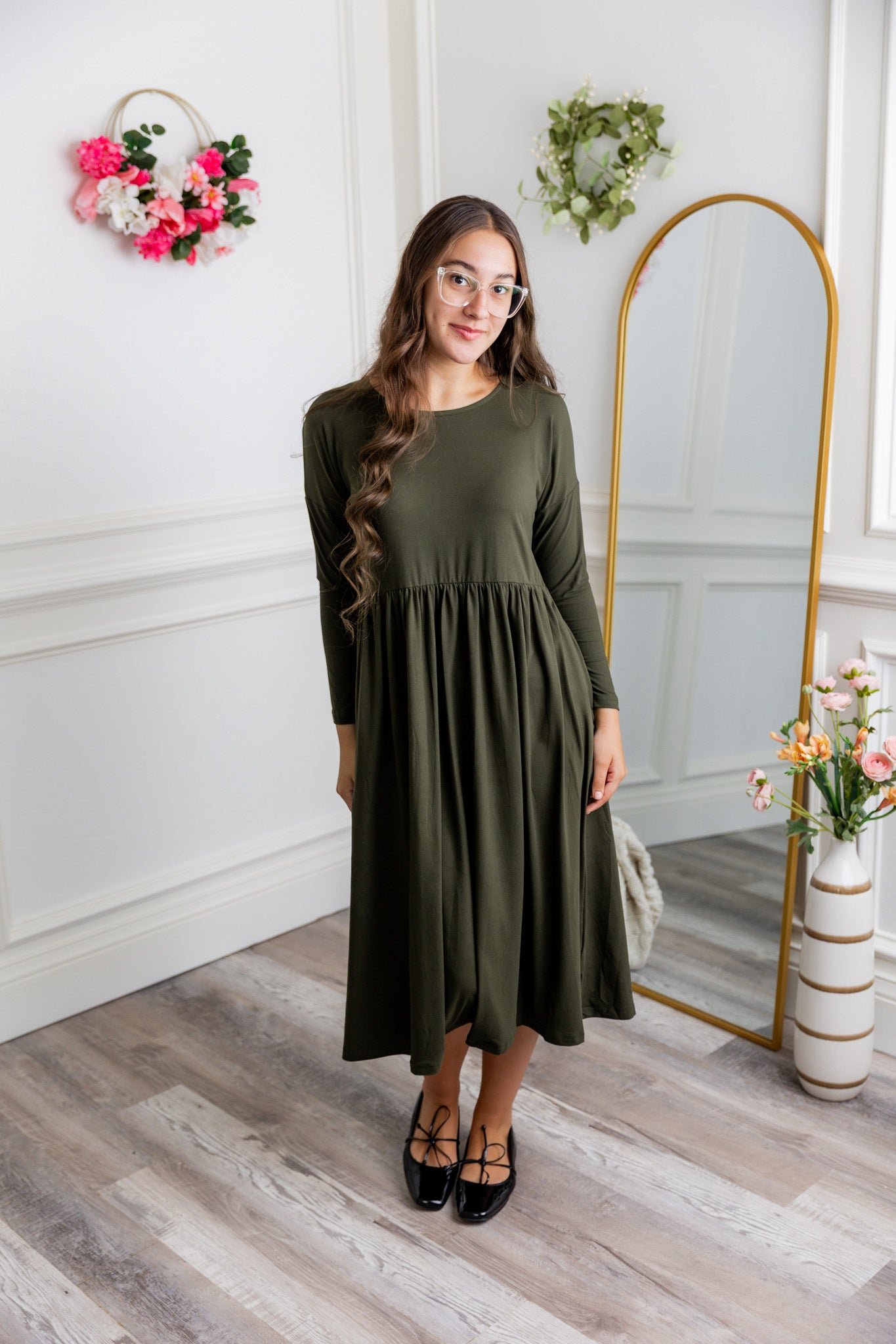Nuggles® Farah Dress in solid color, modest long sleeve midi dress with empire waist, styled with flats for everyday wear.