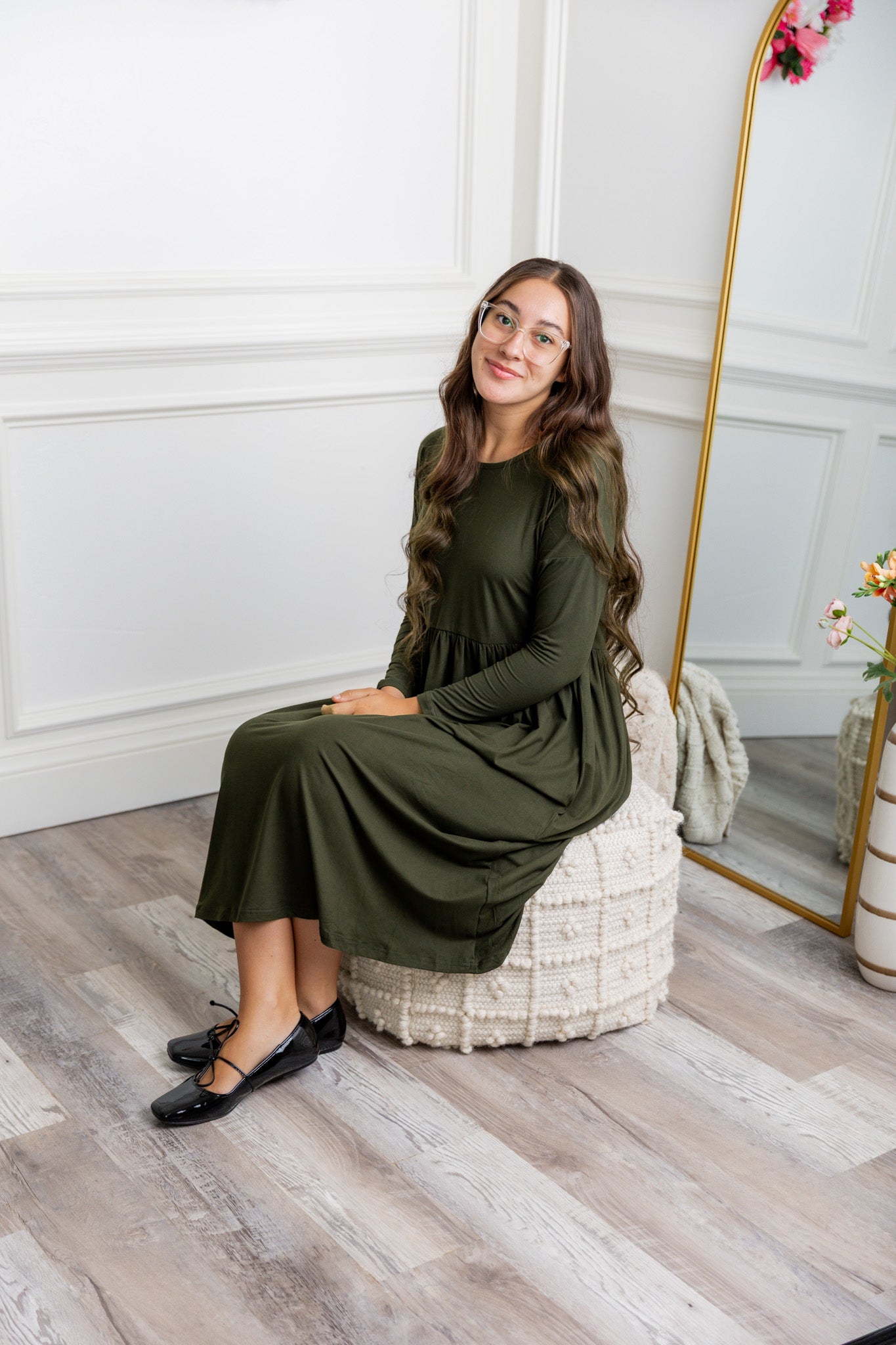 Nuggles® Farah Dress in solid color, modest long sleeve midi dress with empire waist, styled with flats for everyday wear.