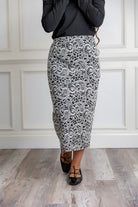 Model wearing the Nuggles® Karina Lined Lace Skirt with modest midi length, paisley lace overlay, and pull-on elastic waistband.