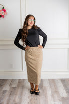 Model wearing the Nuggles® Karina Lined Lace Skirt with modest midi length, paisley lace overlay, and pull-on elastic waistband.