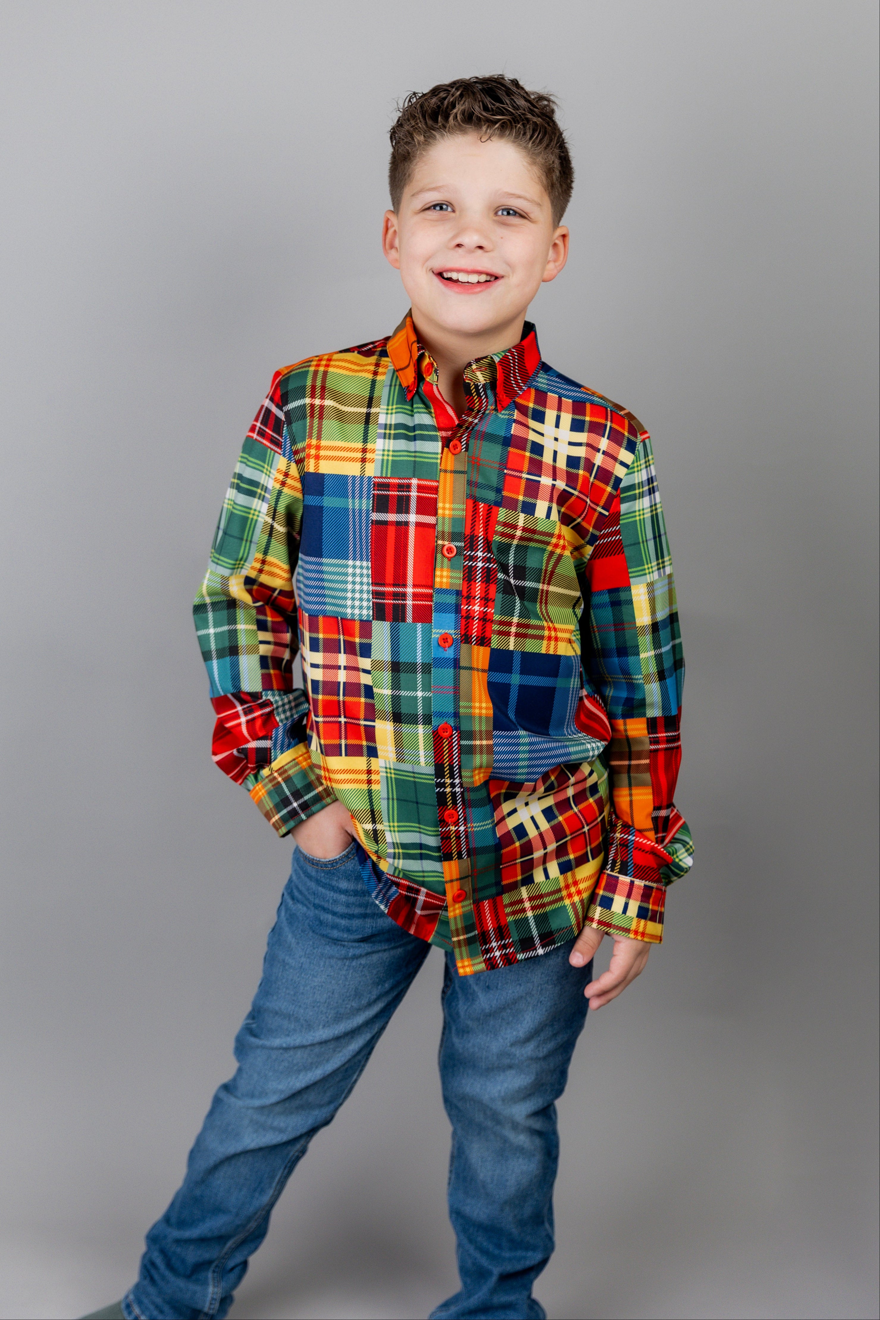 Model wearing Nuggles® Boy's Button Down Shirt in Patch Plaid