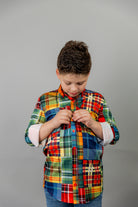 Model wearing Nuggles® Boy's Button Down Shirt in Patch Plaid