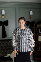 Nuggles® Rilynn Top – modest women’s printed top with ruffled sleeves and relaxed fit.