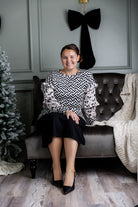 Nuggles® Rilynn Top – modest women’s printed top with ruffled sleeves and relaxed fit.