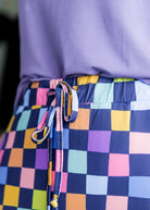Model wearing Nuggles® 27 inch Sport Flex Skirt with pockets and drawstring waistband